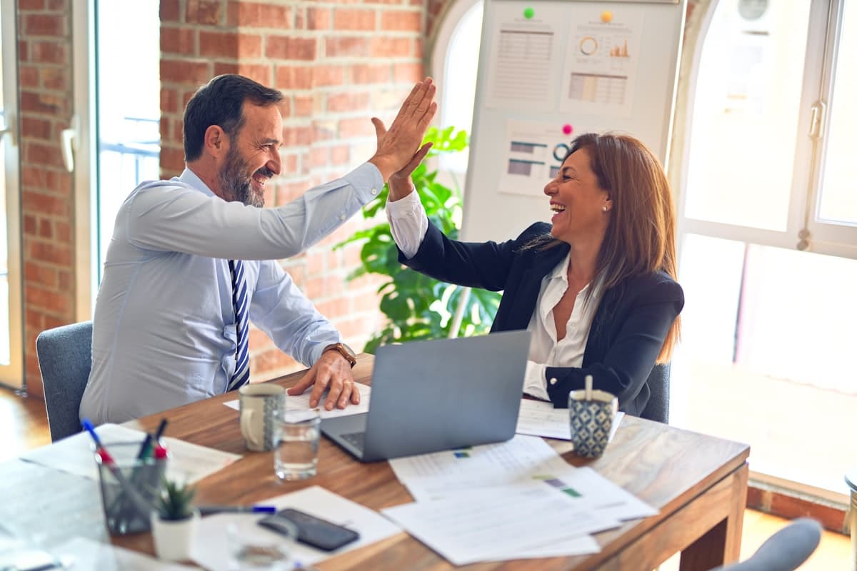Senior professionals collaborating in a bright office